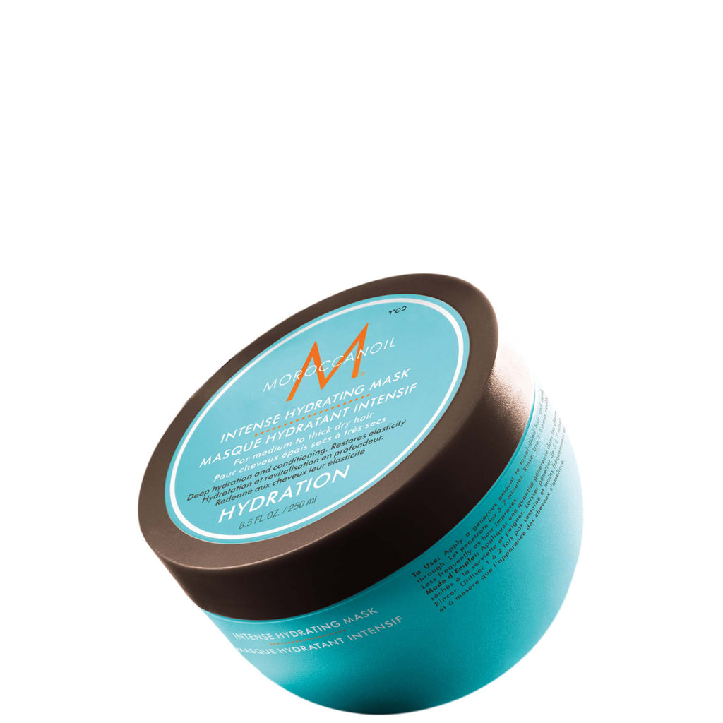 Blue hair mask jar with brown lid on a white background