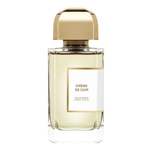 Perfume bottle labeled 'Câçme de Cuir' with a gold cap on a white background