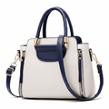 Women's cream and navy blue leather top handle satchel shoulder bag with gold hardware