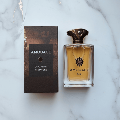 Amouage Dia Man Miniature with box on marble surface