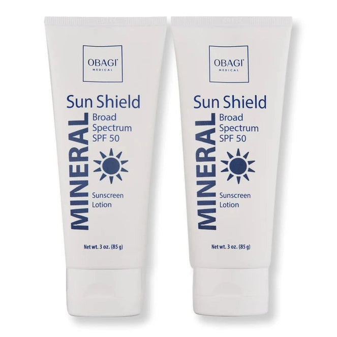 Two tubes of Obagi Sun Shield Mineral Broad Spectrum SPF 50 sunscreen on a white background